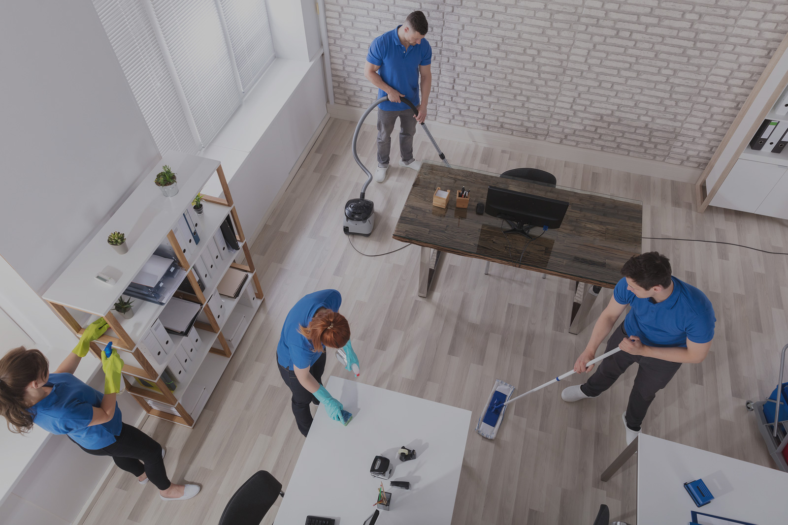 Cleaning team working together in an office